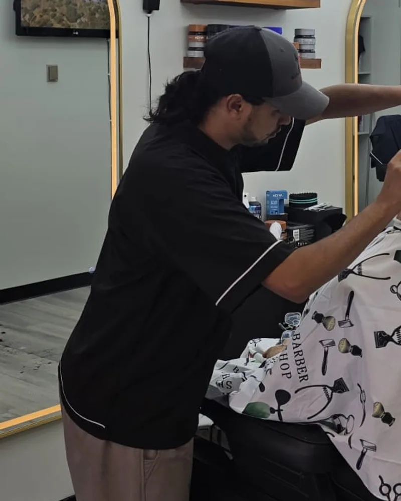 Zaki working on a client at Royal Look Barber Shop in Broadmead Village, Saanich